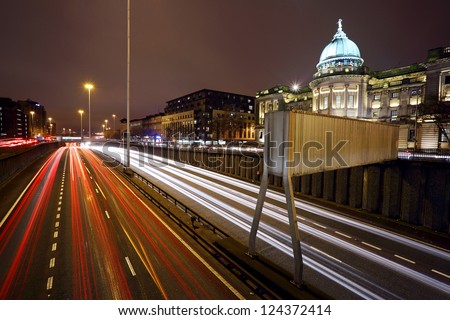 Long exposure showing Car light trails at rush hour in Glasgow, overlooking the M8 motorway and Mitchell Library from Charring cross