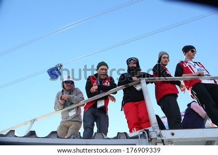 SOCHI, RUSSIA- February 13th:  (LR) Coach Luke Allen and Skiers Justin Dorey, Peter Adam crook, Noah Bowman, and Mike Riddell watch the ski slopestyle event on February 13th 2014 in Sochi Russia.