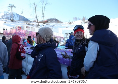 SOCHI, RUSSIA- February 13th: USA Coaches Ben Dejo, skier Devin Logan and US Freeski Staff watch their athletes perform at the Olympic Men\'s slopestyle event on February 13th 2014 in Sochi Russia.