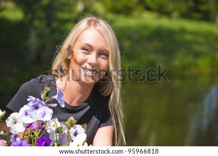 Girl with dragonfly, flowers on a natural green background