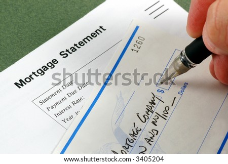 Writing a check for the mortgage payment