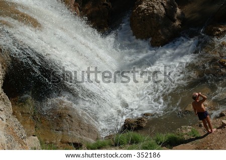 Man near waterfall, Fifth Water hot springs, Uintas, Utah