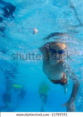 Boy freestyle swimming, underwater shot
