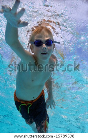 Boy freestyle swimming, underwater shot