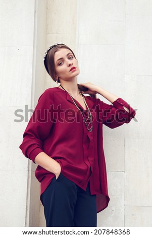 Young model girl in classic clothes
