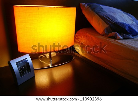 Bedside table with lamp, and clock