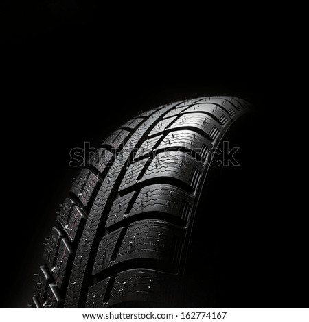 Winter Car tires close-up wheel profile structure on black background