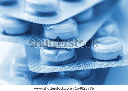 Tablets pills packaging pharmacy medicine medical on blue white background