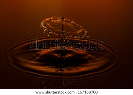 liquid art Water drop collision splash a Liquid Sculpture like a umbrella in orange red colors