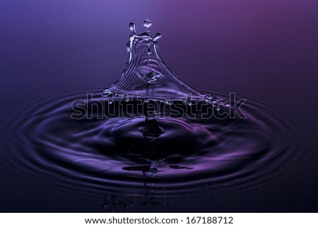 liquid art Water drop collision splash a Liquid Sculpture like a triangle in purple blue colors