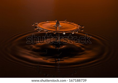 liquid art Water drop collision splash a Liquid Sculpture like a umbrella in orange red colors