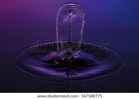 liquid art Water drop collision splash a Liquid Sculpture like a figure in purple blue colors