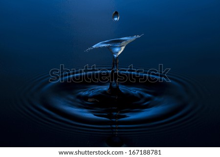 liquid art Water drop collision splash a Liquid Sculpture like a human figure in blue colors
