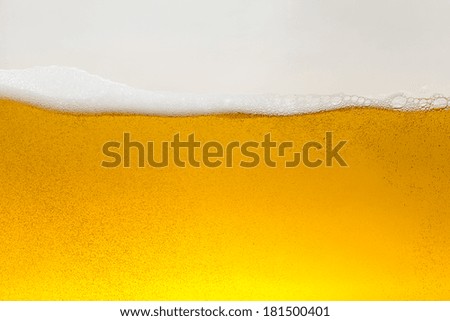 Golden Beer alcohol wave with foam and bubbles