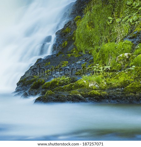 Waterfall with rocks cascade landscape magic