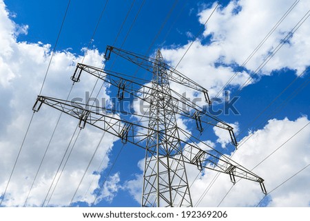 power pole on blue cloudy sky long-distance pipeline electrosmog