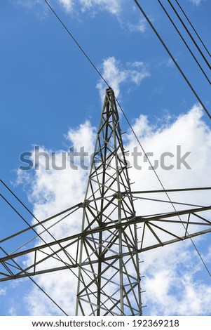 electricity pylon close-up on blue cloudy sky industry electricity production