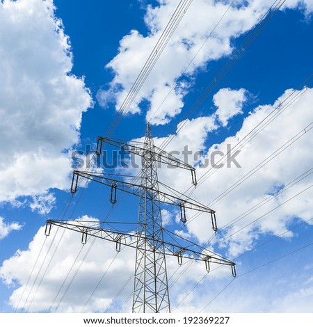 electricity pylon on blue cloudy sky long-distance pipeline