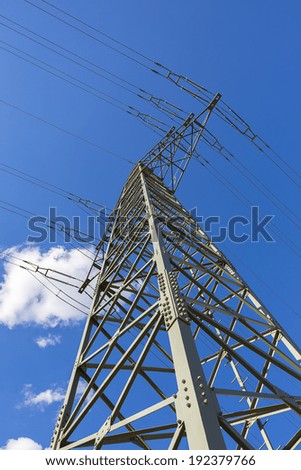 power cable tower on sky with clouds