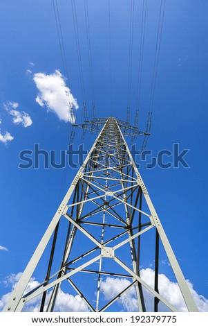 power pole energy on blue sky with clouds from a different perspective