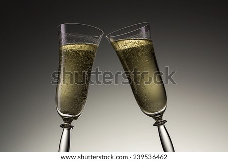 toast with two champagne glasses on new year\'s eve