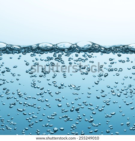 sparkling mineral water on blue gradient background