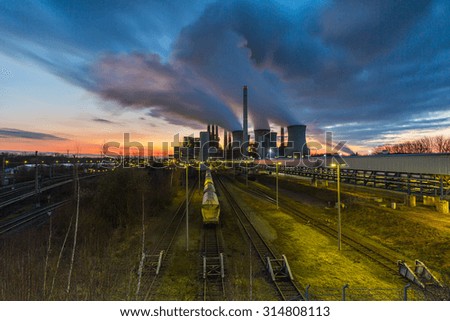Coal power station with cloudy sunset sky in neurath, germany