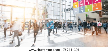crowd of anonymous business people at a trade show