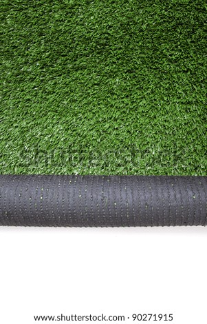 Green artificial turf rolled