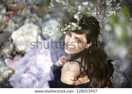 beautiful brunette woman in the park on a warm spring day