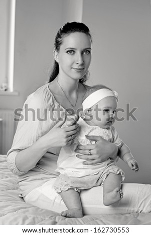 Mother and Baby hugging. Happy Family. Black and White