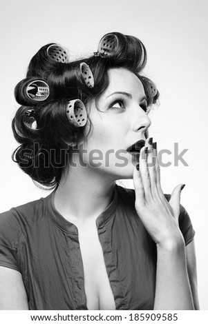 woman with hair rollers. Black and white