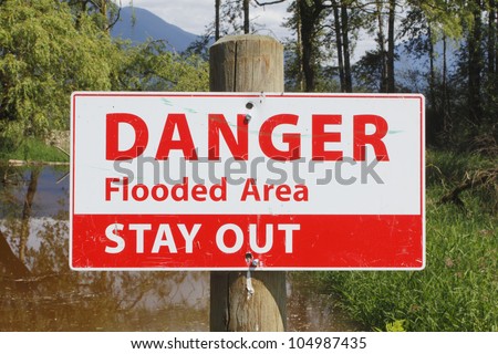 A sign warns to stay away from a flooded area/Flood Water Signage/Danger, stay out of flooded area