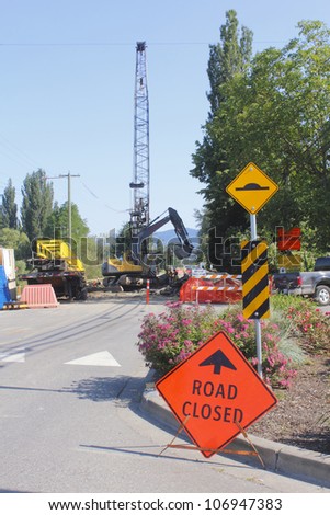 A sign warns the road is closed up ahead/Road closed due to construction/A road is closed due to construction