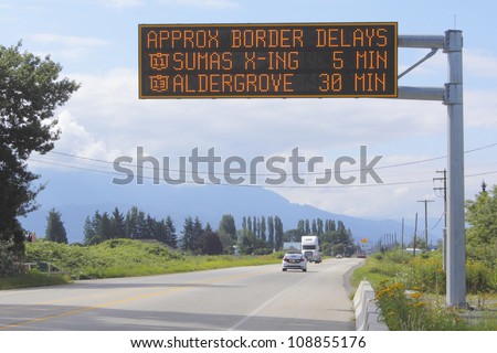 A sign indicates wait time at the British Columbia and Washington State border crossing/Wait Time Signage/A sign indicates wait time at the British Columbia and Washington State border crossing