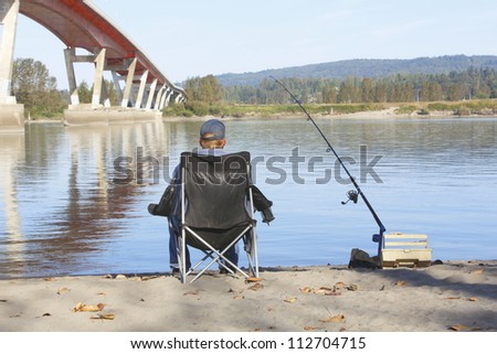 A laid back and peaceful morning spent at his favorite watering hole/Relaxed Day for Fishing/A leisurely morning of fishing by a river