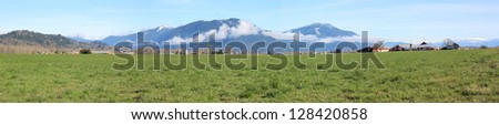 A wide angle panoramic view of Valley grass land along British Columbia\'s southern coastline/Panoramic Grassland/Panorama of valley grass land.
