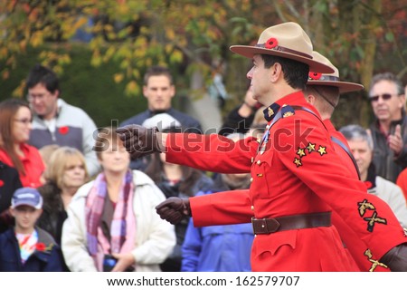 ABBOTSFORD, BRITISH COLUMBIA/CANADA -Â?Â? NOVEMBER 11: The Royal Canadian Mounted Police march during Remembrance Day ceremonies  on November 11, 2013 in Abbotsford, British Columbia, Canada.