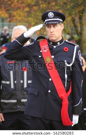 ABBOTSFORD, BRITISH COLUMBIA/CANADA -Â?Â? NOVEMBER 11: A member of Canada's Honor Guard salutes during Remembrance Day ceremonies in Abbotsford, British Columbia on November 11, 2013.