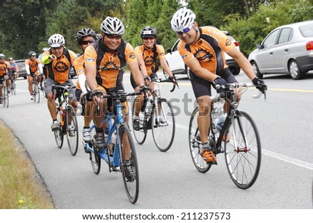 ALDERGROVE, BC/CANADA - AUGUST 16: 1400 cyclists crossing the border enjoy a two day ride from Seattle to Vancouver during the 33rd annual RSVP Cycling Tour on August 16, 2014.