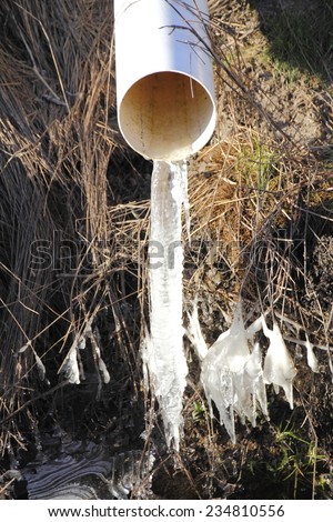 Ice forms on the end of a frozen pipe during a deep freeze/Frozen Pipe/Ice forms on the end of a frozen pipe during a deep freeze