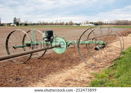 A water irrigation wheel and pump used to irrigate crops in Washington State/Water Irrigation Wheel and Mechanism/A water irrigation wheel and pump used to irrigate crops in Washington State.
