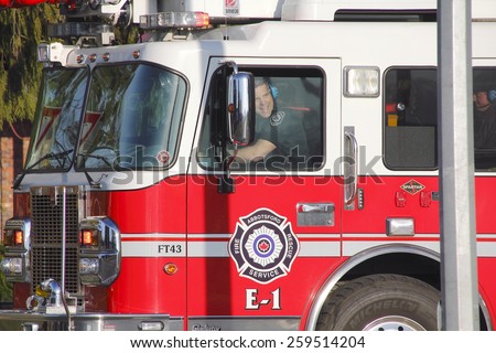 ABBOTSFORD, BC/CANADA: MARCH 9, 2015: First responders from the Abbotsford fire and rescue service on their way to a fire at the airport on March 9, 2015.