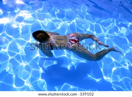 Girl swimming underwater in Bikini