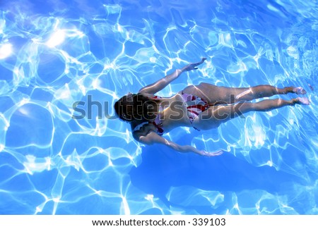 Girl swimming underwater in Bikini