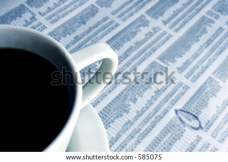 Morning Business coffee with financial page of newspaper