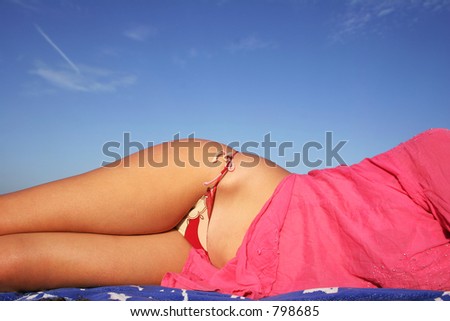 Female form on the beach in bikini