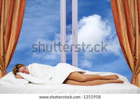 Woman asleep in bed by window