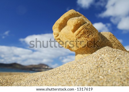 Easter Island Moai half buried in the sand