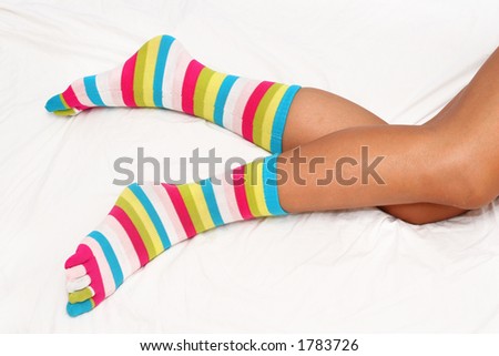 Bright socks on womans feet